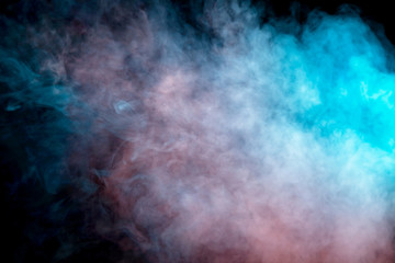Background of orange, purple, red and blue wavy smoke on a black isolated ground. Abstract pattern...