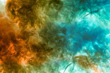 Fototapeta na wymiar Colorful steam exhaled from the vape with a smooth transition of color molecules from yellow to blue on a white background like a collision of two jets of smoke.