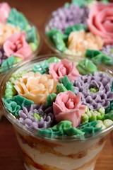 Delicious, appetizing, fragrant dessert. Triple delicious light dessert, decorated with oil flowers.