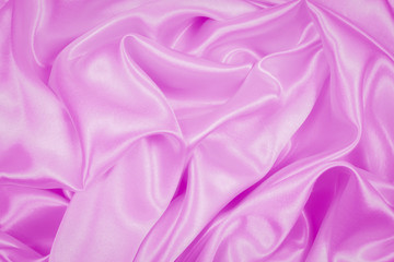 Obraz premium Beautiful smooth elegant pink silk or satin texture can use as abstract background. fabric color