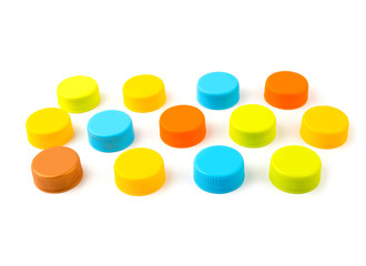 Colorful Plastic bottle caps on white background. selective focus