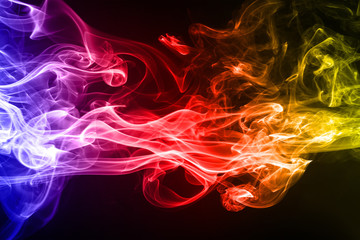Abstract colorful smoke on black background and darkness concept, fire design