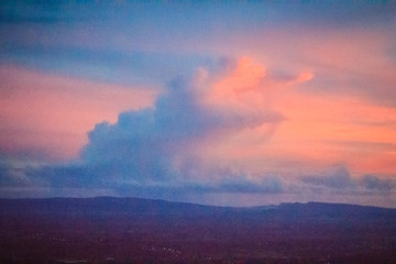 Dusk sky and cloud at morning dawn background. Vibrant colors of the sky with clouds from dusk till...