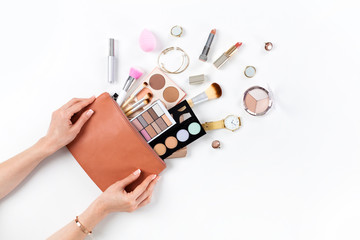 Makeup bag with cosmetic beauty products.