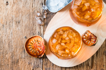 Bael juice ice tea on wooden table , healthy drink
