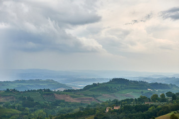 Fototapeta na wymiar Aerial view Italian landscape Tuscany hills countryside in the rain 