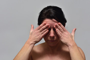 Fototapeta premium middle-aged woman with headache