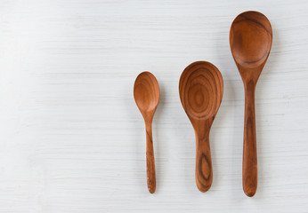 Zero waste kitchen use less plastic concept / Various sizes of wooden spoon and wooden cooked rice ladle