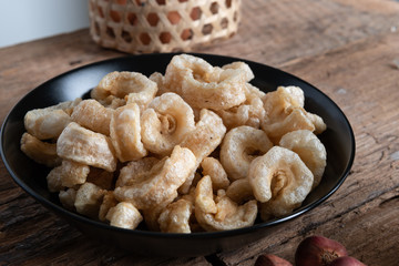 Pork rinds also known as chicharon or chicharrones , kab moo