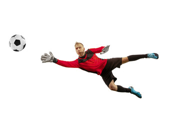 Male soccer player goalkeeper catching ball in jump. Silhouette of fit man with ball isolated on...