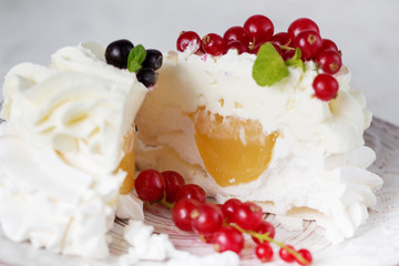 Pavlova cakes with cream and fresh summer berries. Close up of Pavlova dessert with forest fruit and mint. Food photography