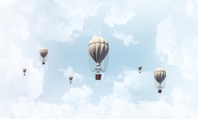 Flying hot air balloons in the air.