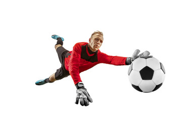 Fototapeta na wymiar Male soccer player goalkeeper catching ball in jump. Silhouette of fit man with ball isolated on white studio background