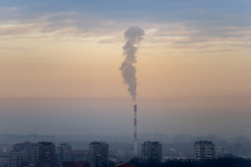 Cityscape and view to the city central heating plant in the winter season