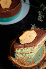 Chic cake with chocolate and pear cream. Delicious cake for the holiday decorated with pear.