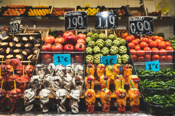 Beautiful fruits in European fair in ready-to-eat glasses. Healthy food for sale in La Boquería market in Barcelona, Spain