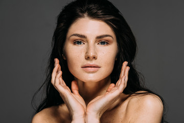attractive tender woman posing isolated on grey