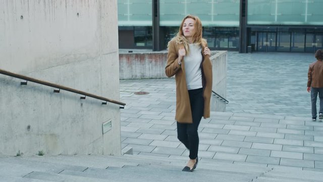 Cheerful and Happy Young Woman Actively Dancing While Walking Up the Stairs
