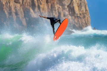 Surfer jumping mid air