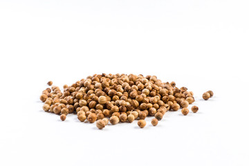 heap of coriander seeds isolated on white background