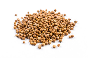 heap of coriander seeds isolated on white background