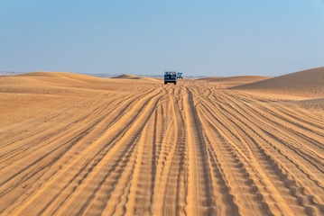 Vintage open top 4x4 SUV in the desert in Dubai, United Arab Emirates