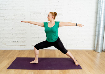 Fototapeta na wymiar Strong woman training yoga in at modern studio home in healthy lifestyle concept