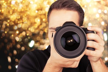 Male Photographer with Camera on  background