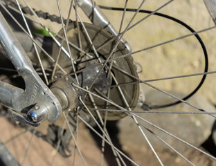 Fototapeta na wymiar Old bicycle chain and spokes in closeup