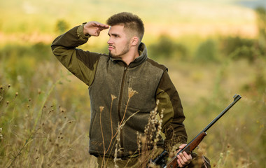 Focus and concentration of experienced hunter. Hunting and trapping seasons. Man brutal gamekeeper...