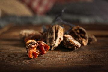 Bitten dried persimmon on wooden background,bunch