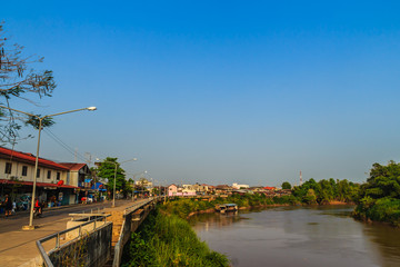 Landscape of Muang district, Phichit province, Thailand in summer with colorful houses and a blue sky on Nan river bank. Phichit is a province of Thailand and far 330 km from Bangkok.