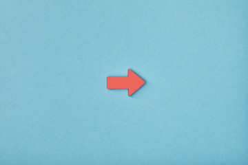 top view of red horizontal pointer on blue background