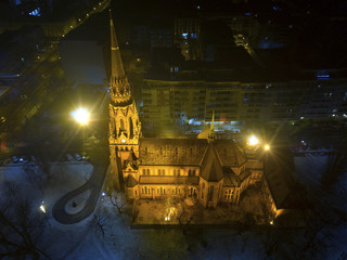 Aerial shot of an Neo-Romanesque style church at winter
