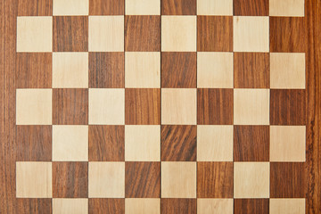 top view of empty wooden chess board