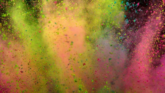Super slowmotion shot of color powder explosion isolated on black background.