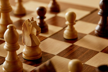 selective focus of chess on wooden chess board