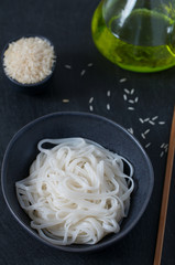 Rice noodles in a black bowl