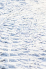 Wheel marks on pure white snow