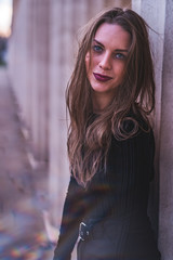 Fototapeta premium fashionable portrait of young beautiful woman in a European city on a sunny winter day