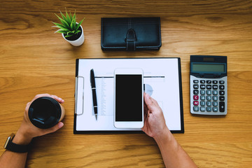  Businessman using smartphone to the situation on the market value , Business concept.