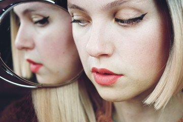 Close up of a woman with no makeup showing her natural mature skin