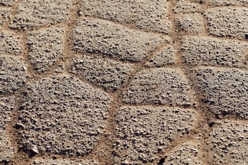 Broken  pavement of a road.