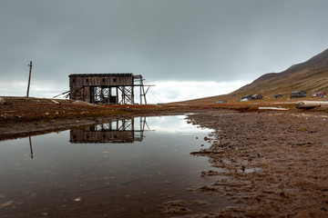 Fototapeta na wymiar Old abandoned mining facilities, used for the coal mining industry, Svalbard Norway