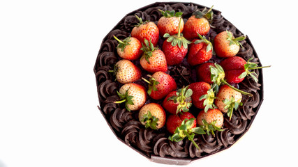 Ice cream cake makeup with strawberry sauce and fresh strawberries