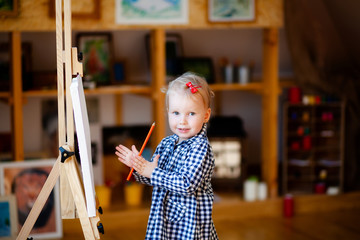 pretty happy girls 2 years old little artist paints a picture and laughs