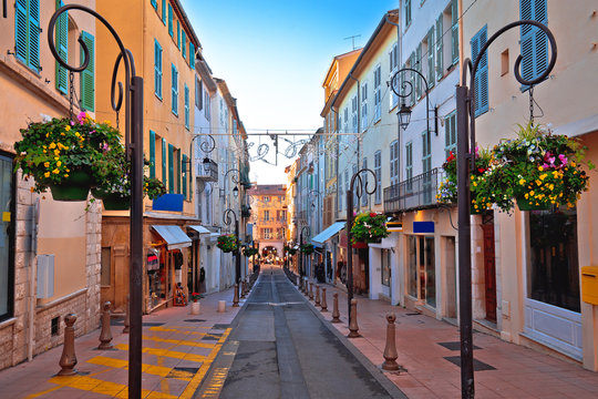 Colorful street in Antibes walkway and shops view