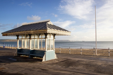 Victorian shelter along the Esplanade promenade with the Royal Hotel, Weymouth, Dorset, England, UK