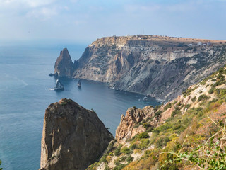Beautiful view of Cape Fiolent on the Black Sea. Famous place for tourism near Sevastopol in Crimea. Mountains and blue sea.