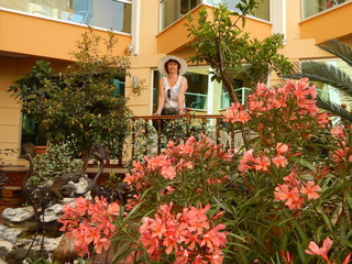 girl on the veranda with flowers.